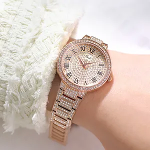 Close-up of luxury rose gold women's watch with shimmering diamonds and Roman numerals