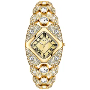 Montre bracelet GEDI de luxe dorée pour femme avec strass brillants et cadran en losange