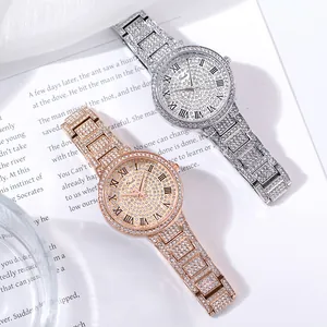 Detail of luxury women's watches in silver and rose gold with crystal-encrusted finish