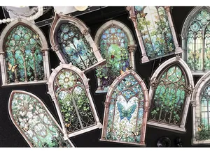 Macro detail of vintage gothic stained glass window stickers with vines and butterflies