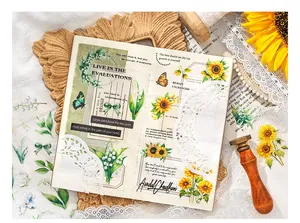 Close-up of vintage flower stickers with sunflower and butterfly for DIY scrapbooking