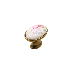 European style cabinet handle with white ceramic floral pattern and bronze alloy base