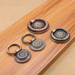 Set of four antique zinc alloy ring handles with daisy floral base for cabinets