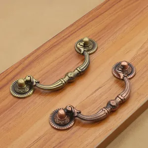 Antique brass furniture pendant handles with ornate relief patterns for drawer cabinets