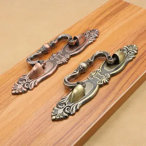 Antique European style furniture handles in bronze and copper finish with ornate carvings