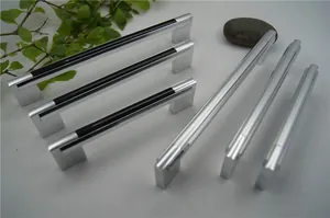 Detailed macro of aluminum cabinet handles showing silver finish and black accent strips