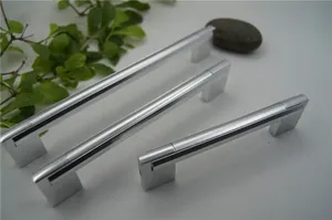 Three sizes of matte silver aluminum U-shaped cabinet handles on a textured background