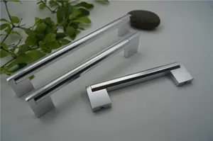Modern silver matte aluminum cabinet handles in three sizes on a textured gray background