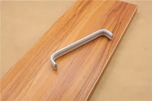 Detailed macro view of matte silver U-shaped aluminum alloy handle with parallel side grooves