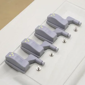 Set of four grey LED cabinet hinge lights with screws for wardrobe door illumination