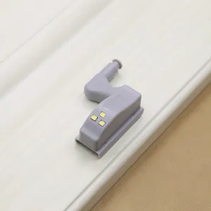 Detail of grey LED hinge light with three beads and mechanical sensor for cabinets