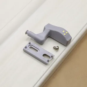 Detailed components of LED hinge light including gray plastic body and mounting screws