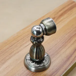 Antique bronze magnetic door stopper with vintage European floral relief pattern