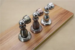 Detailed macro view of European vintage magnetic door stoppers in antique bronze finishes