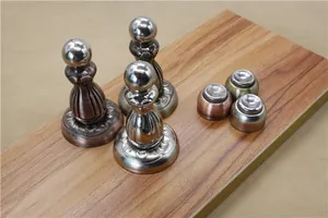 Detail showing vintage bronze and brushed steel magnetic door stoppers in various styles