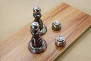 Classic antique bronze magnetic door stoppers with ornate European floral engravings