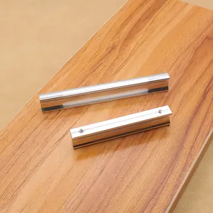 Sleek silver aluminum alloy cabinet handles in long and short sizes on wooden surface