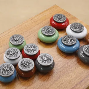 Macro detail of antique floral ceramic drawer knobs in various vintage colors