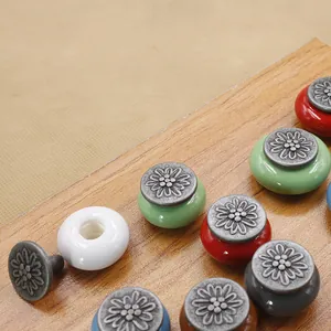 Antique flower engraved metal and ceramic cabinet knobs in multiple vintage colors