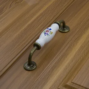 European style ceramic cabinet handle with antique bronze finish and floral pattern