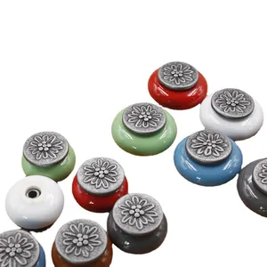 Antique style colorful ceramic cabinet knobs with floral embossed metal base for drawers