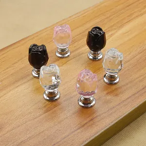 Detail of rose-shaped crystal cabinet knobs in black, pink, and clear colors