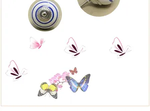 Detail of round ceramic cabinet knob with blue stripes and mounting bolt structure