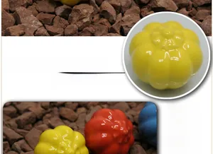 Detail of colorful pumpkin-shaped ceramic handles for cabinets with smooth glazed finish