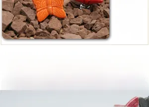 Close-up of ceramic butterfly drawer pulls in orange and red with fine wing textures