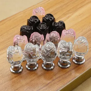 Detail showing crystal rose cabinet knobs in black, pink, and clear flower petal designs