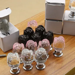 Detail of crystal rose knobs in black pink and clear colors with silver metal bases