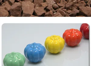 Detailed view of colorful pumpkin-shaped ceramic knobs in green, blue, yellow, and red colors