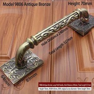 Detail of antique bronze door handle 9806 with measurements 327mm length on wood panel