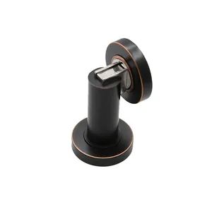 Matte black magnetic door stopper with bronze accents on a clean white background