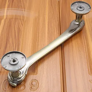 Close-up of antique bronze door handle with brushed metal finish and round bases