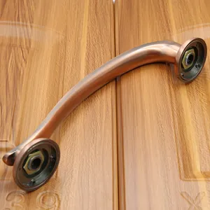 Detailed macro view of antique bronze door handle with brushed texture and mounting base