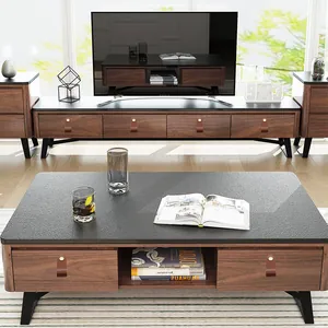 Detail of modern brown leather drawer pulls with brass studs on walnut furniture