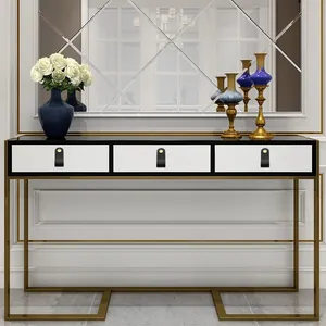 Modern white entryway console with black leather handles and gold metal frame structure
