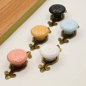 European vintage ceramic door knobs with floral relief and antique bronze alloy base
