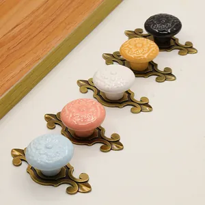 Five assorted retro ceramic knobs with embossed flowers and zinc alloy bases for cabinets