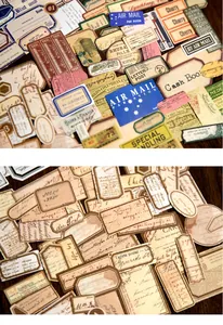 Detailed close-up of retro aesthetic paper labels and stickers on dark wood background