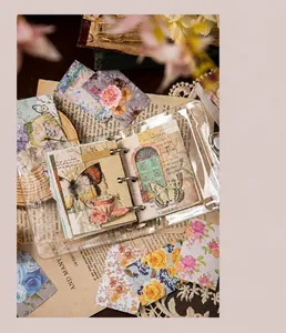 Close-up of vintage floral stickers and PVC binder for creative scrapbooking DIY