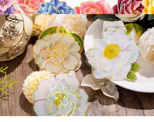 Macro detail of 3D floral PET stickers with laser gold edges and colorful peony designs