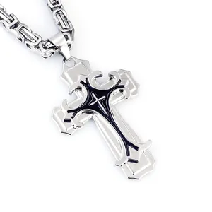 Macro detail of silver double-layered cross pendant with Byzantine style chain for men