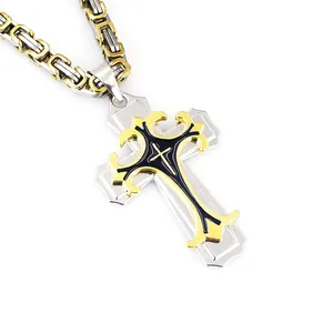 Macro view of a two-tone cross pendant with black enamel and Byzantine chain