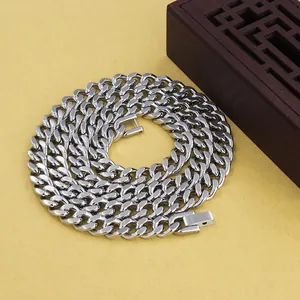 Detailed view of polished silver cuban link chain with secure fold-over clasp closure