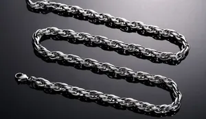 Detailed view of silver stainless steel twisted chain with a secure lobster clasp closure