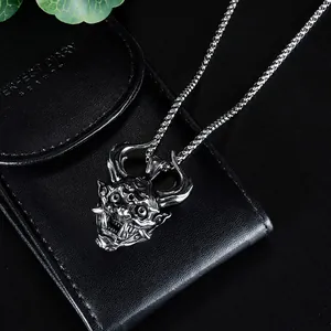 Macro shot of vintage horned demon skull pendant made of durable stainless steel