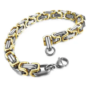 Tweekleurige zilveren en gouden Byzantijnse schakelarmband met karabijnsluiting