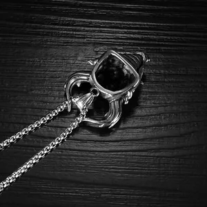 Macro shot of 316L stainless steel engraving on a gothic skull pendant for men